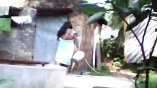 Desi wife taking shower in open air