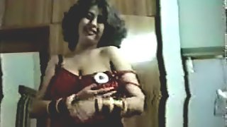 Indian wife teasing her hubby in red nighty